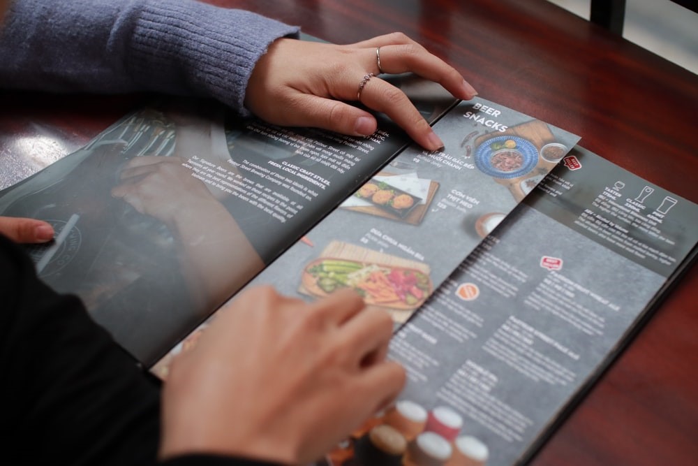 Customers reading a restaurant menu