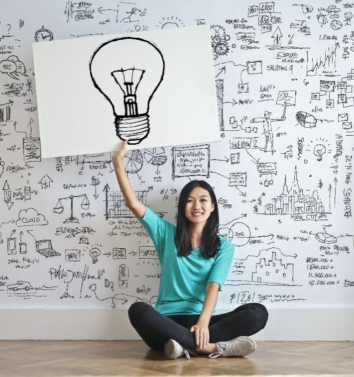 a woman is happy that her ideas are protected by intellectual property security advisors