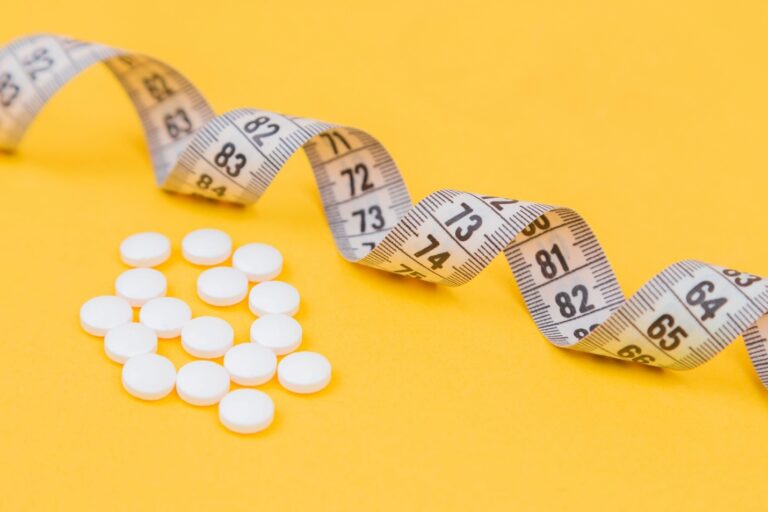 dietary supplements and a measuring tape